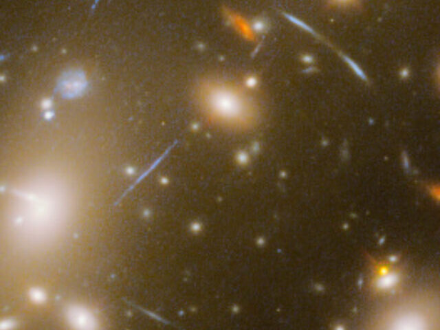 Webb Telescope Reveals Stars in Distant Dragon Arc Galaxy