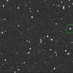 A telescope-captured view of space showing multiple stars or celestial objects. A particular object is highlighted with a green circle, which likely represents the asteroid 2024 YR4. Photo Source: NASA