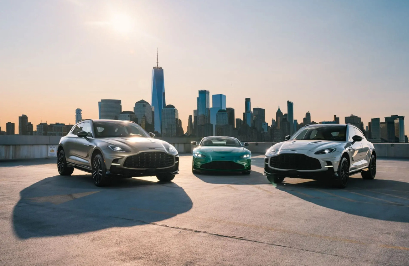 Representative image. Three Aston Martin DBX SUVs are lined up against a backdrop of the New York City skyline.