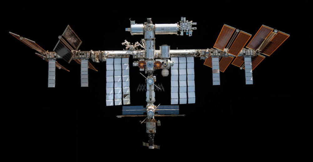 Representative Image: International Space Station (ISS) against the blackness of space. It features large solar panels, various interconnected modules, and docking ports for spacecraft. Photo Source: (nasa.gov)