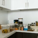 Representative Image. Clear Plastic Container and Glass Jars on a Kitchen Counter. Photo Source: RDNE Stock project (Pexels)