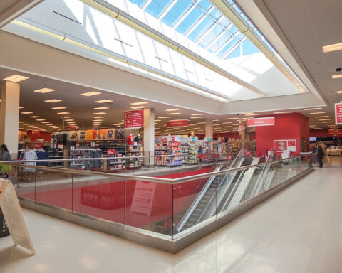 Representative image. Bright, spacious retail store with escalator and clothing section. Photo Source: Nicholas Eckhart (CC BY-NC-SA 2.0)