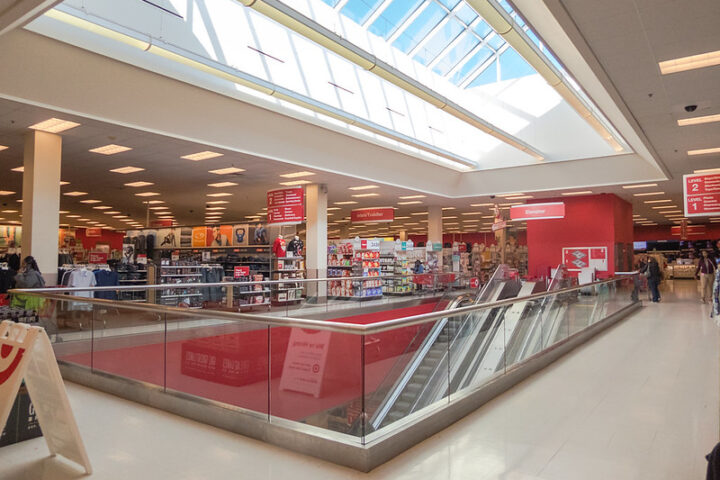 Representative image. Bright, spacious retail store with escalator and clothing section. Photo Source: Nicholas Eckhart (CC BY-NC-SA 2.0)