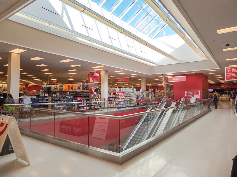 Representative image. Bright, spacious retail store with escalator and clothing section. Photo Source: Nicholas Eckhart (CC BY-NC-SA 2.0)