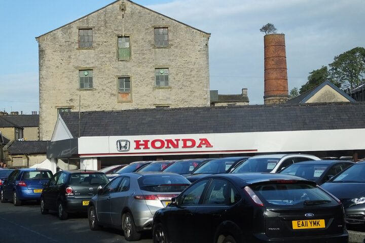 Representative Image. Cars infront of honda showroom. Photo Source: Rochester (CC BY-SA 3.0)