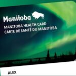 Manitoba Health Card with a dark silhouette of trees and a lake, giving it a visually appealing design. Photo Source: Government of Manitoba