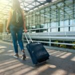 Representative image Woman Walking on Pathway While Strolling Luggage, Photo Source: Alex P (Pexels)