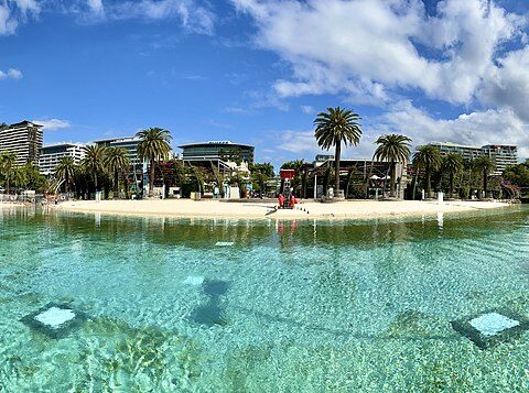 Representative Image. Clear and calm body of water with a sandy beach in the background. Photo Source - Kgbo (CC BY-SA 4.0)