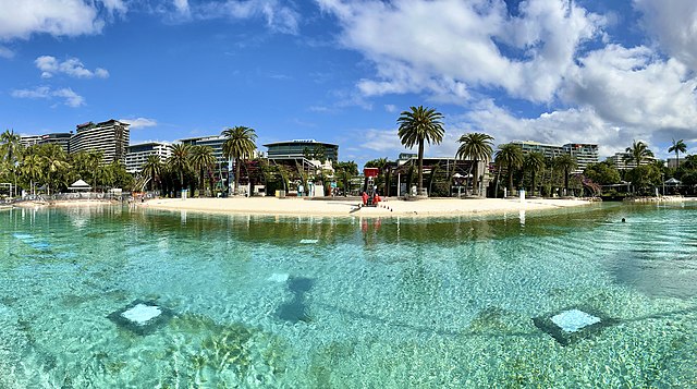 Representative Image. Clear and calm body of water with a sandy beach in the background. Photo Source - Kgbo (CC BY-SA 4.0)