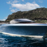 A sleek motorboat with a polished wooden deck. Photo Source - Riva