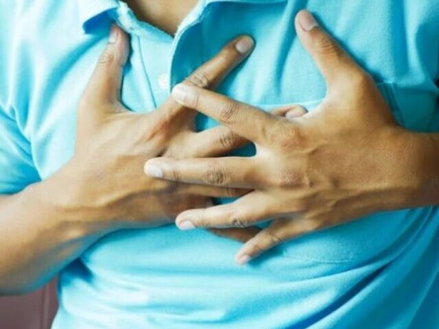 Close-up of a Man in Blue Polo Shirt with Hands on Chest, Photo Source: Towfiqu barbhuiya (pixels)