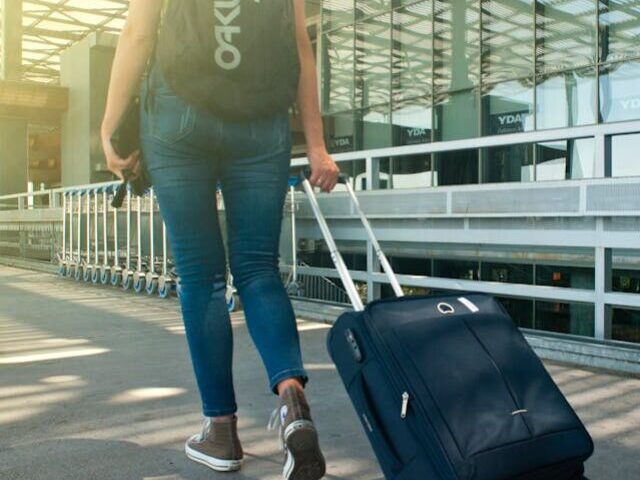 Representative image Woman Walking on Pathway While Strolling Luggage, Photo Source: Alex P (Pexels)