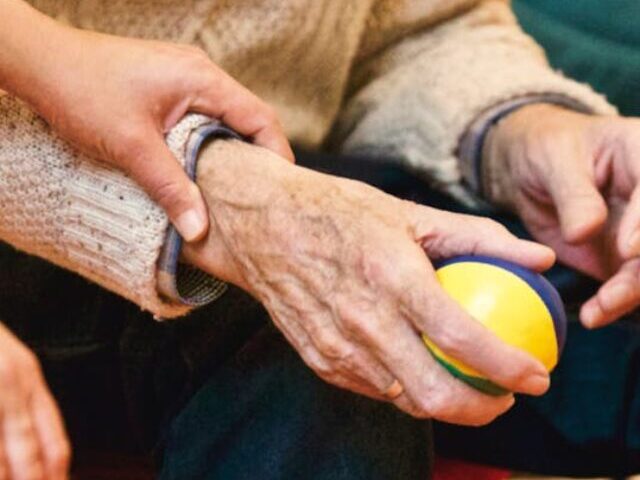 Person Holding a Stress Ball.