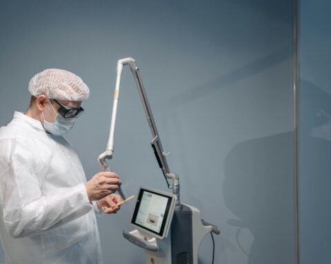 The man operating a medical or cosmetic laser device, performing a procedure requiring hygiene and safety precautions. Photo Source: Pexels (Pavel Danilyuk)