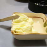 Representative image. Fresh butter in square dish. Photo Source: Searobin (CC BY-SA 3.0).