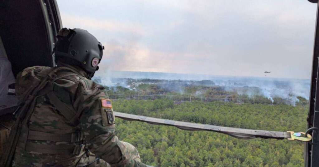 Representative image. Soldier observes wildfire from helicopter. Photo Source: SC National Guard (Twitter).