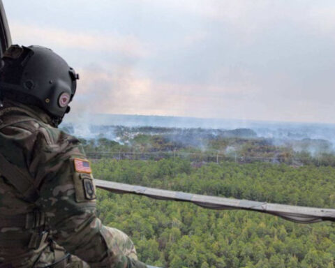 Representative image. Soldier observes wildfire from helicopter. Photo Source: SC National Guard (Twitter).