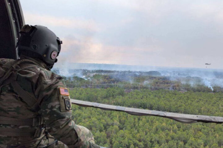 Representative image. Soldier observes wildfire from helicopter. Photo Source: SC National Guard (Twitter).