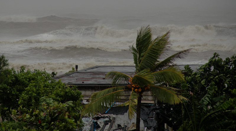 Representative Image: A powerful storm scene with rough ocean waves crashing in the background, indicating an intense cyclone or hurricane. EU Civil Protection and Humanitarian Aid (CC BY-ND 2.0)