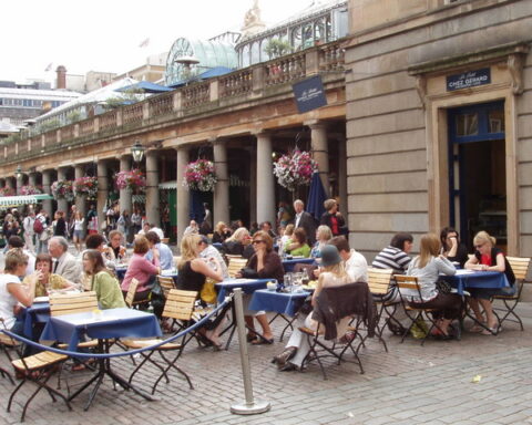 Representative Image. A bustling outdoor café scene. Photo Source - David Hawgood (CC BY-SA 2.0)