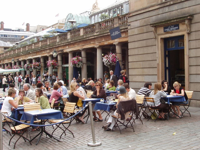 Representative Image. A bustling outdoor café scene. Photo Source - David Hawgood (CC BY-SA 2.0)