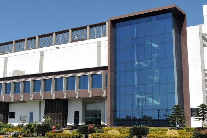 Representative Image. Glenmark building, blue glass facade. Photo Source: Glenmark Pharma.