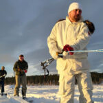 Teams pull rope in snow. Photo Source: Adam Zewe (MIT News).