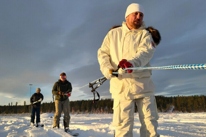 Teams pull rope in snow. Photo Source: Adam Zewe (MIT News).