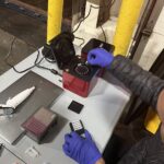 Florida International University scientist Diego Cardeñosa inserts the collected samples from imported fish into the PCR device to identify the fish species. Photo Source:: NOAA Fisheries