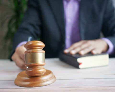 Representative Image. A person doing legal proceeding in a court room. Photo Source - Towfiqu barbhuiya (CCO 1.0)