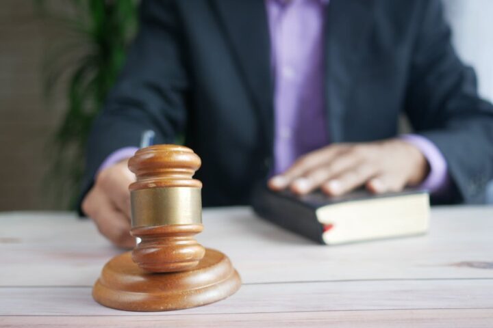 Representative Image. A person doing legal proceeding in a court room. Photo Source - Towfiqu barbhuiya (CCO 1.0)