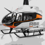 A helicopter, model R88, parked inside a hangar with a sleek and modern design. Photo Source - Robinson Helicopter Company