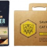 The left side has a pouch of Alehouse Clam Chowder by SeaBear. Photo Source - Seabear. The right side has a box of Savage Cat Food in chicken flavor. Photo Source - Savage Cat Food.