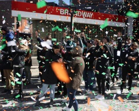 A lively street celebration with a crowd of people enjoying the moment. Photo Source - southbostonparade (Instagram)