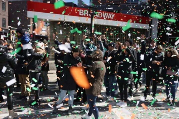 A lively street celebration with a crowd of people enjoying the moment. Photo Source - southbostonparade (Instagram)