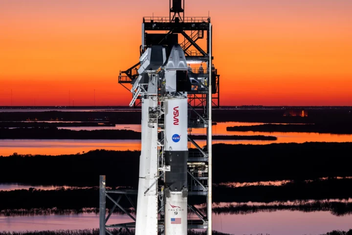 A SpaceX Falcon 9 rocket with the company’s Dragon spacecraft on top is seen during sunset on the launch pad at Launch Complex 39A at NASA’s Kennedy Space Center in Florida on Tuesday, March 11, 2025, ahead of the agency’s SpaceX Crew-10 launch. Crew-10 is the 10th crew rotation mission with SpaceX to the International Space Station as part of the agency’s Commercial Crew Program, sending NASA astronauts Anne McClain and Nichole Ayers, along with JAXA (Japan Aerospace Exploration Agency) astronaut Takuya Onishi and Roscosmos cosmonaut Kirill Peskov to the orbiting laboratory for about a four-month science mission. Liftoff is targeted for 7:03 p.m. EDT Friday, March 14, 2025. SpaceX, Photo Sources: Nasa.gov