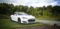 Representative Image. White Tesla Model S park on the green grass. Photo Source: Pickpik.com