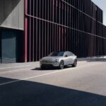 Featuring a sleek, modern car parked on an urban street with a stylish architectural background. Photo Source: Volvo Cars Global Newsroom