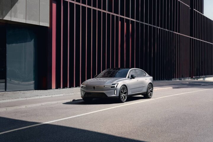 Featuring a sleek, modern car parked on an urban street with a stylish architectural background. Photo Source: Volvo Cars Global Newsroom